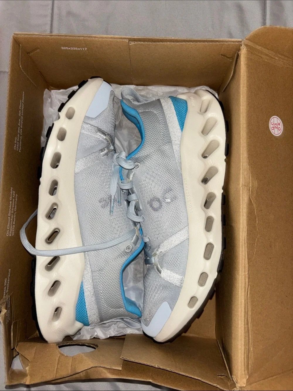 On Running Women's Sneakers in Light Gray with Blue Accents